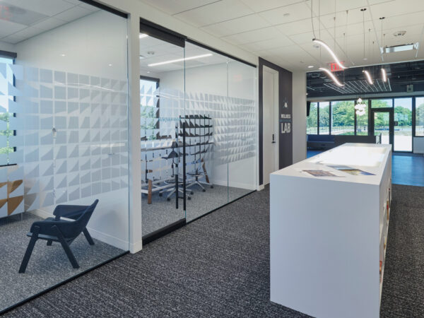 Interior of an office building with glass wall rooms