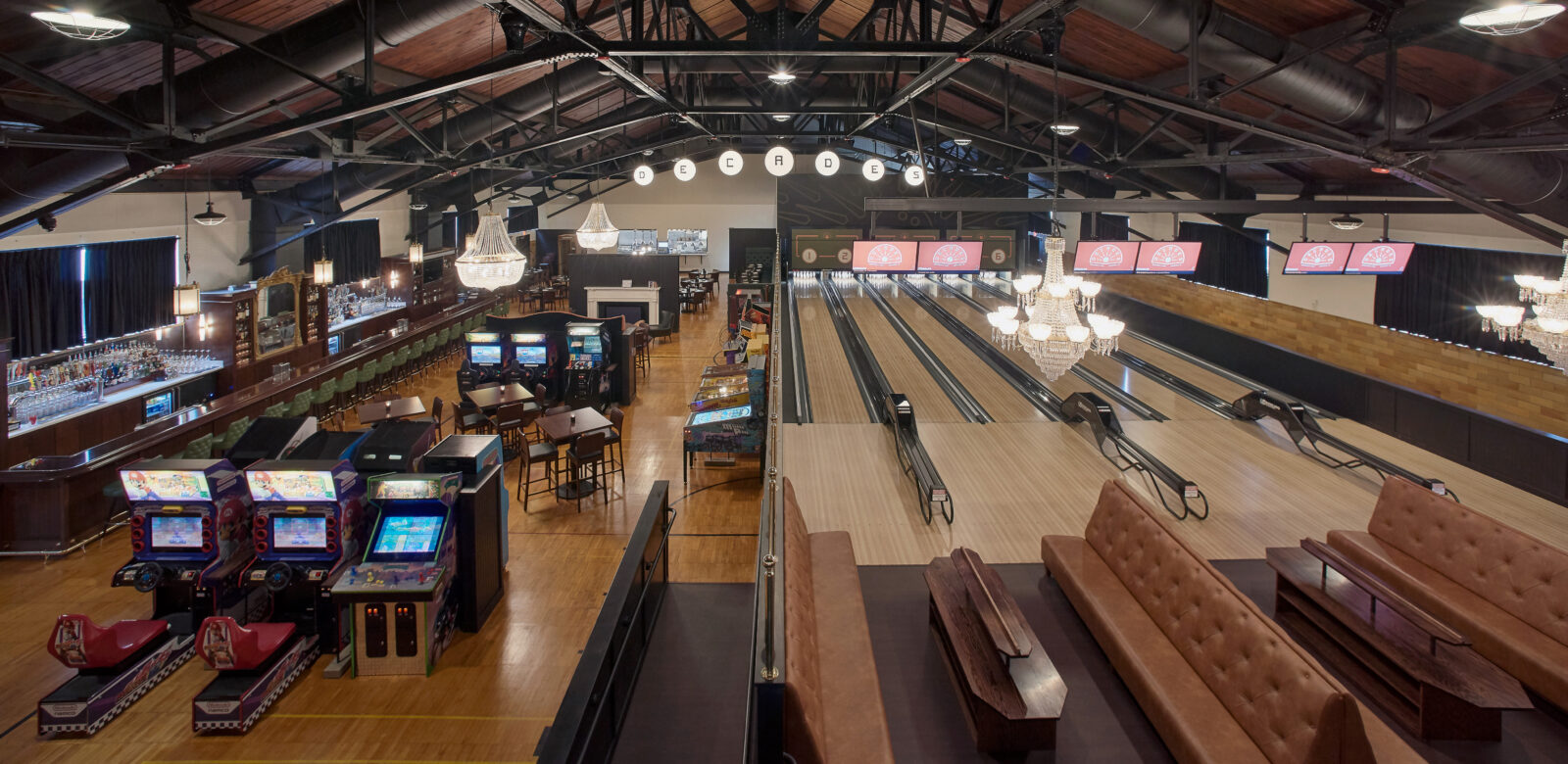 Interior of a Decades with bowling ally lanes and other arcade games