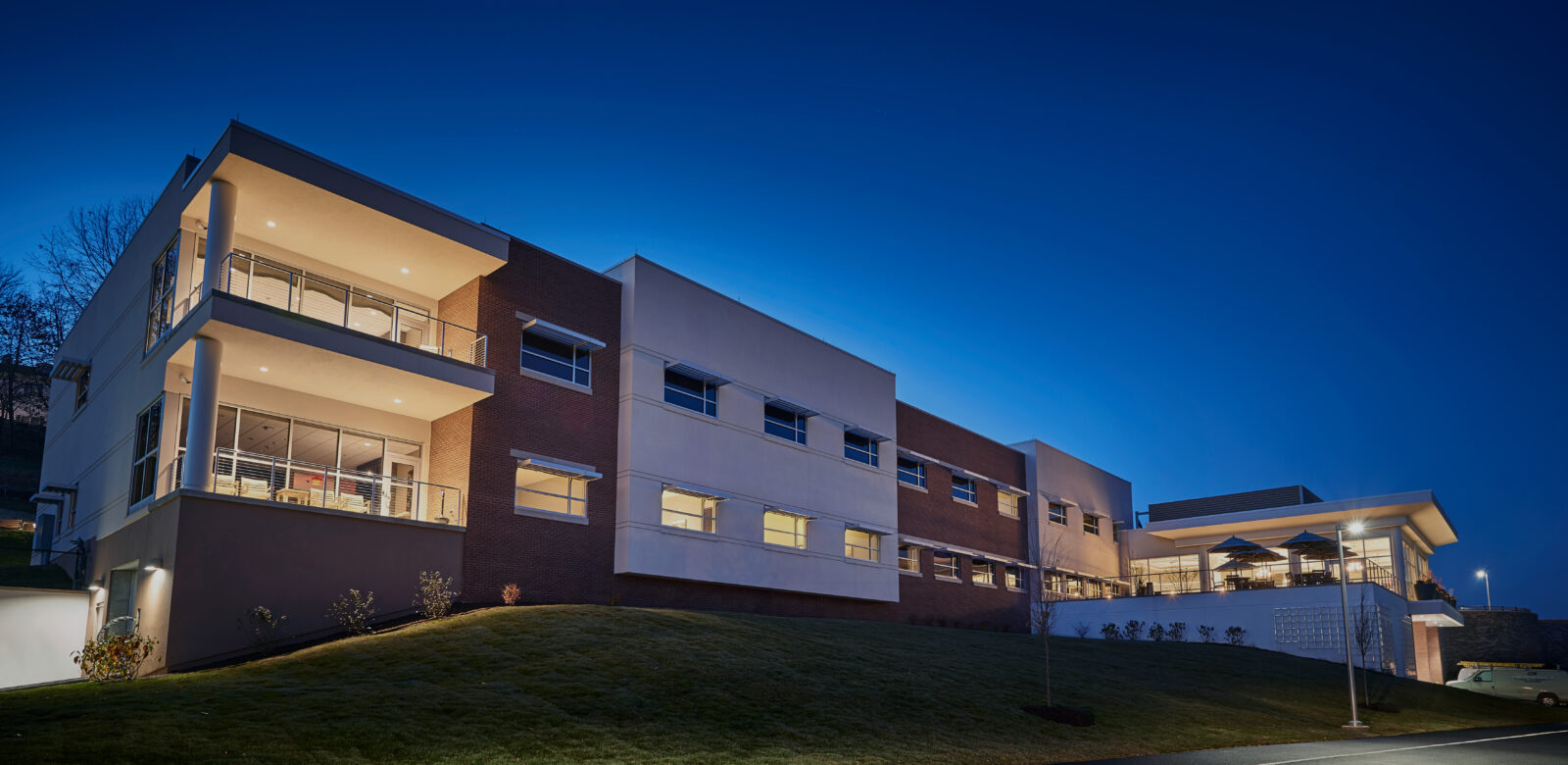 Exterior of a stone and brick building a night