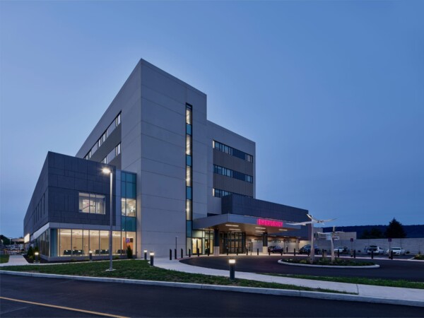 Exterior of UPMC West Shore Hospital in the evening