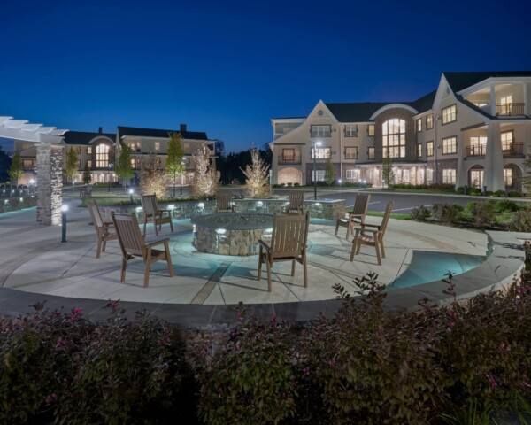 Exterior of The Groves at Senior Living Meadowood Campus at night