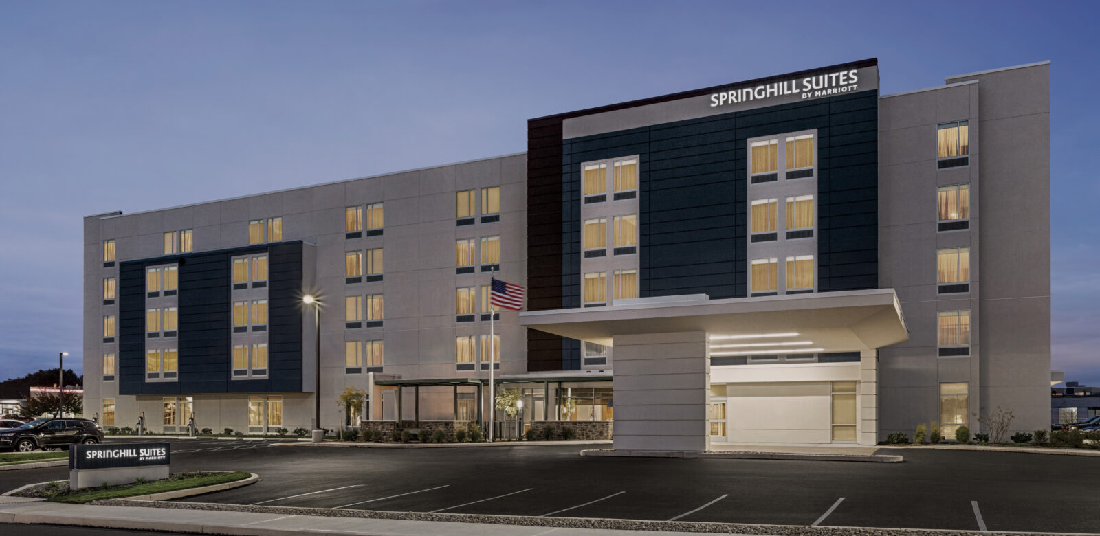 Exterior view of a Springhill Suites in the evening