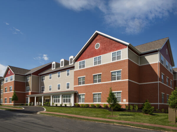 Exterior of a brick and siding senior living building