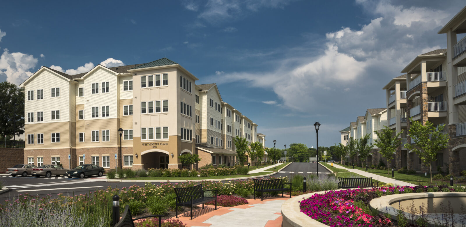 Exterior of multiple buildings with fountains and benches